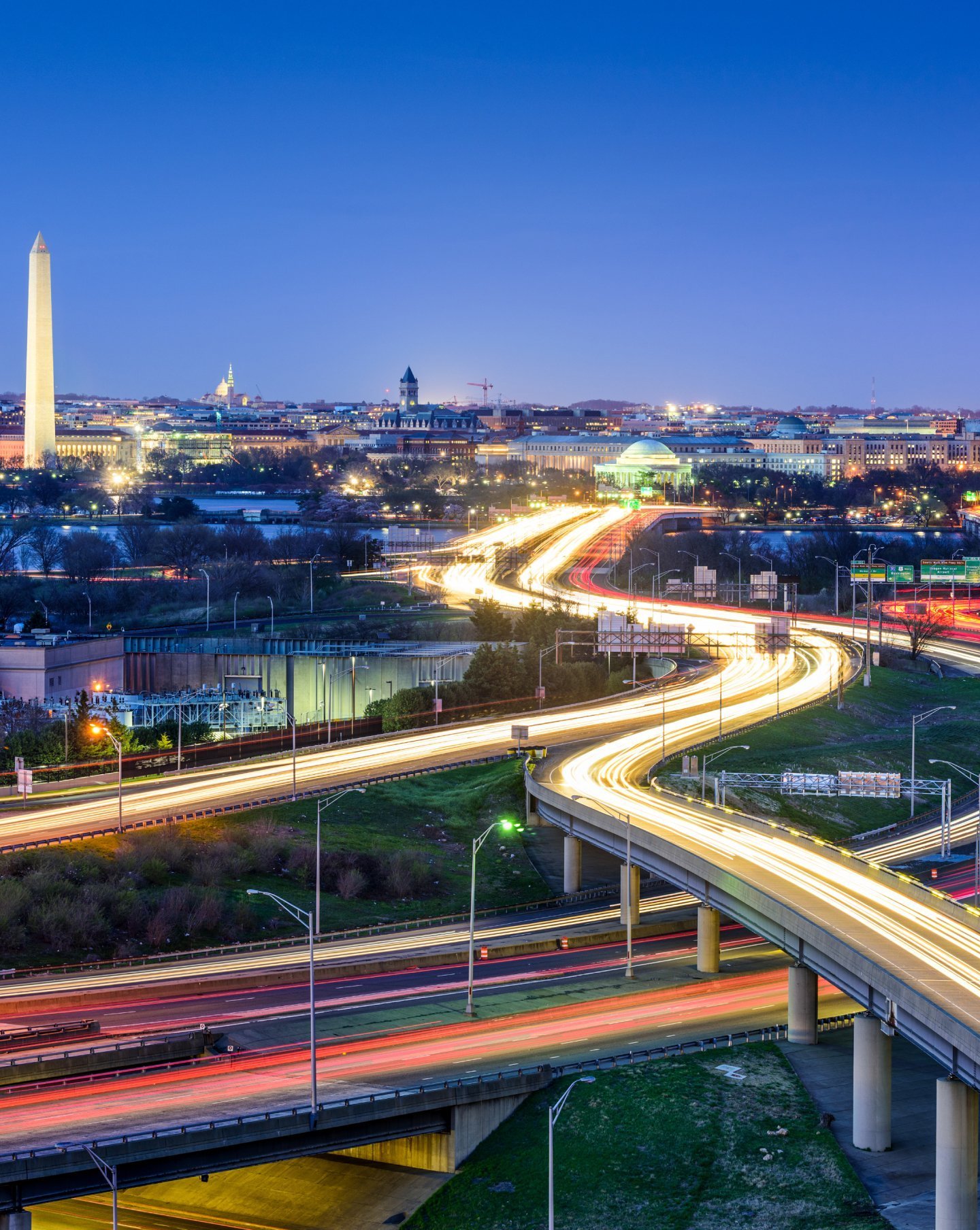 Washington, D.C. highways with the Washington Monument lit up at night
